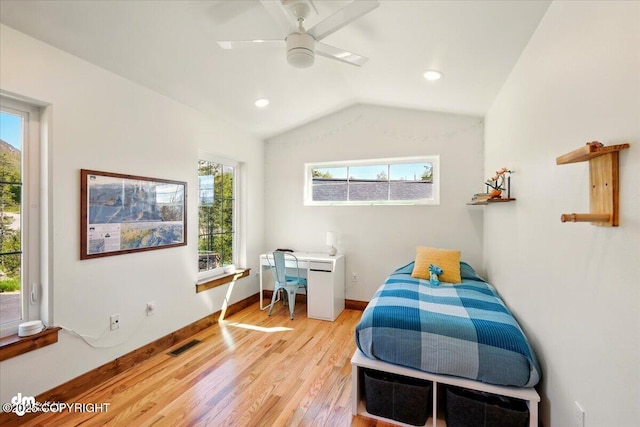 7350 E Narnia Cir, Palmer, AK 99645 - bedroom featuring light wood-style flooring, multiple windows, lofted ceiling, baseboards, and ceiling fan