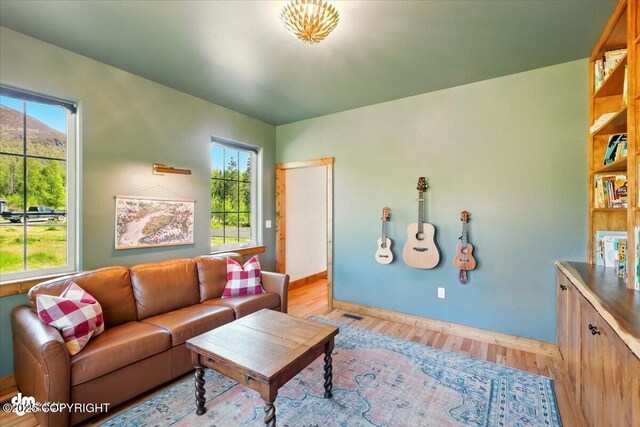 7350 E Narnia Cir, Palmer, AK 99645 - living area with light wood-style flooring and baseboards