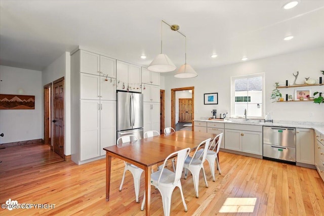 7350 E Narnia Cir, Palmer, AK 99645 - dining area with light wood-type flooring, recessed lighting, and baseboards