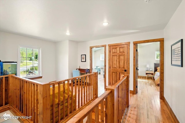 7350 E Narnia Cir, Palmer, AK 99645 - hallway with an upstairs landing, light wood finished floors, recessed lighting, and baseboards