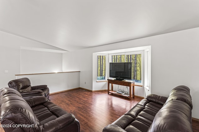 7879 W Sally Ct, Wasilla, AK 99623 - living room with lofted ceiling, wood finished floors, and baseboards