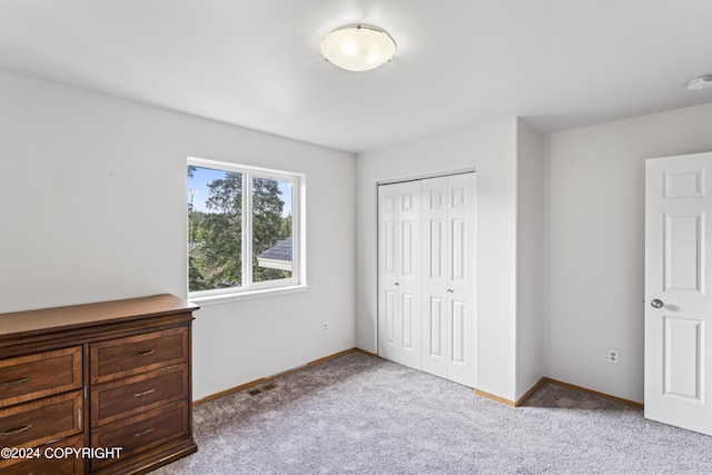 7879 W Sally Ct, Wasilla, AK 99623 - unfurnished bedroom featuring carpet flooring, a closet, and baseboards