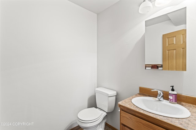 7879 W Sally Ct, Wasilla, AK 99623 - bathroom featuring vanity and toilet