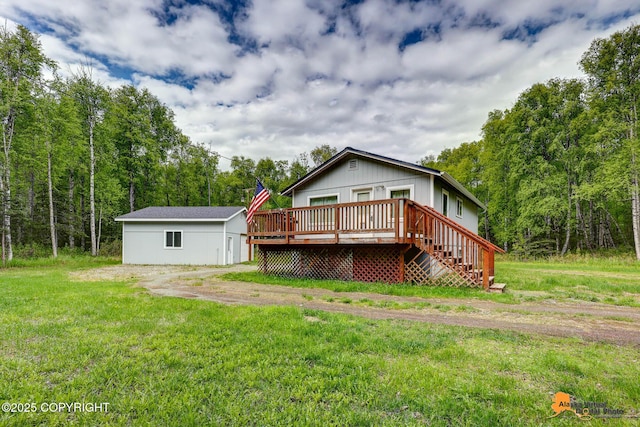 8380 N Gold Creek Cir, Palmer, AK 99645 - back of house featuring a wooden deck, a wooded view, and a yard