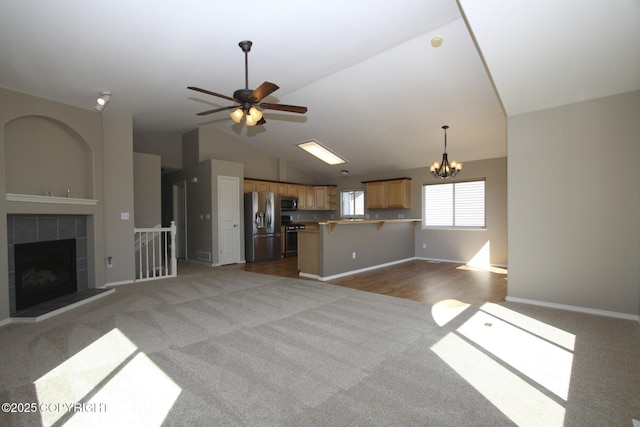 1932 Casey Cusack Loop, Anchorage, AK 99515 - unfurnished living room with carpet floors, lofted ceiling, ceiling fan, a chandelier, and baseboards