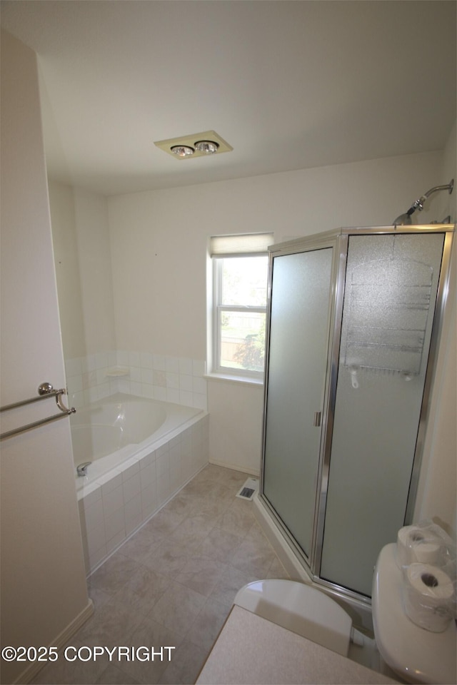 1932 Casey Cusack Loop, Anchorage, AK 99515 - full bath featuring a bath, toilet, a shower stall, and tile patterned flooring