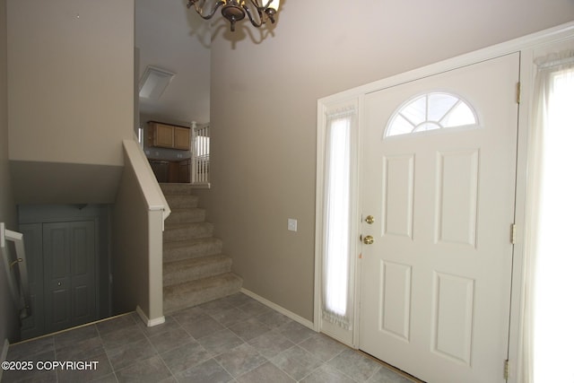 1932 Casey Cusack Loop, Anchorage, AK 99515 - entryway featuring a chandelier, stairway, and baseboards