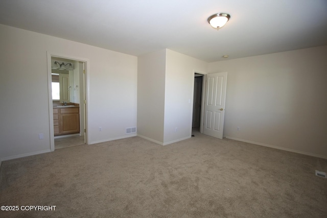 1932 Casey Cusack Loop, Anchorage, AK 99515 - unfurnished room with light colored carpet, baseboards, and a sink