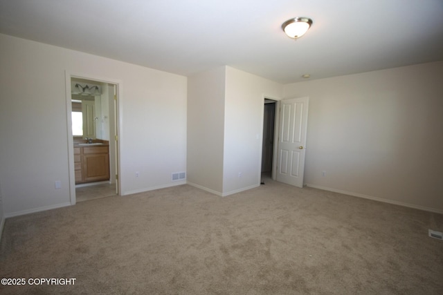 1932 Casey Cusack Loop, Anchorage, AK 99515 - unfurnished room with light carpet, baseboards, and a sink