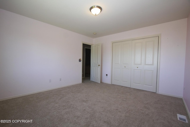 1932 Casey Cusack Loop, Anchorage, AK 99515 - unfurnished bedroom with carpet, a closet, and baseboards