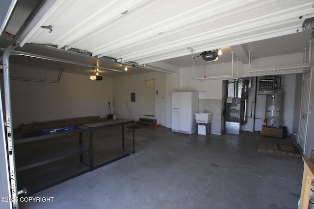 1932 Casey Cusack Loop, Anchorage, AK 99515 - garage with secured water heater, a garage door opener, heating unit, and a sink