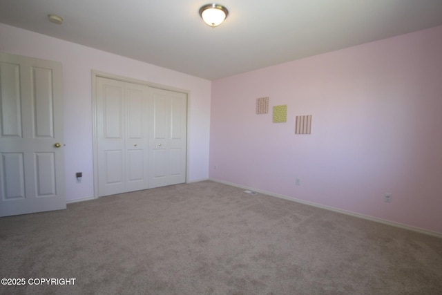 1932 Casey Cusack Loop, Anchorage, AK 99515 - unfurnished bedroom with carpet flooring, a closet, and baseboards