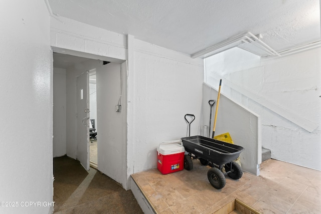 241 N Flower St, Anchorage, AK 99508 - basement with a textured ceiling
