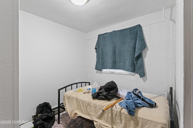 241 N Flower St, Anchorage, AK 99508 - bedroom with a textured ceiling