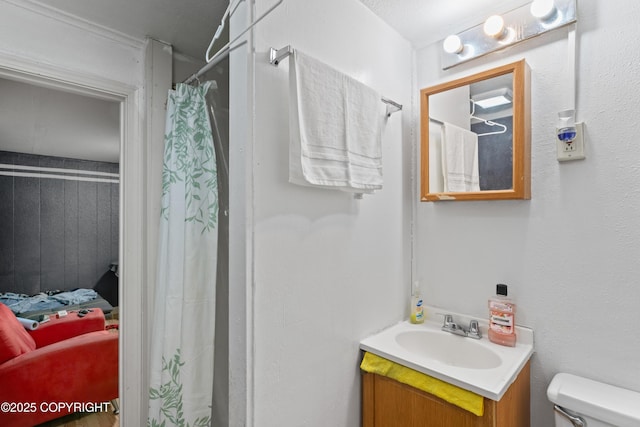 241 N Flower St, Anchorage, AK 99508 - full bathroom featuring vanity, toilet, connected bathroom, and a shower with curtain