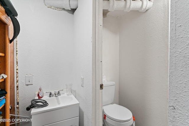 241 N Flower St, Anchorage, AK 99508 - half bathroom featuring toilet and vanity