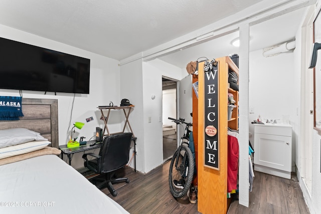 241 N Flower St, Anchorage, AK 99508 - bedroom with wood finished floors and a sink