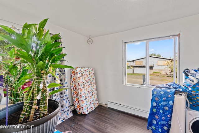 241 N Flower St, Anchorage, AK 99508 - sitting room with a baseboard radiator and wood finished floors