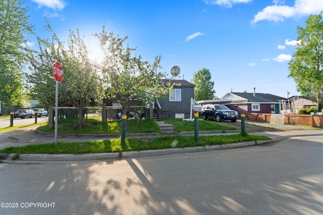 241 N Flower St, Anchorage, AK 99508 - view of front of house with a residential view