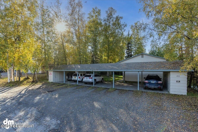 4312 Penguin St, Anchorage, AK 99503 - view of car parking featuring a detached carport and driveway