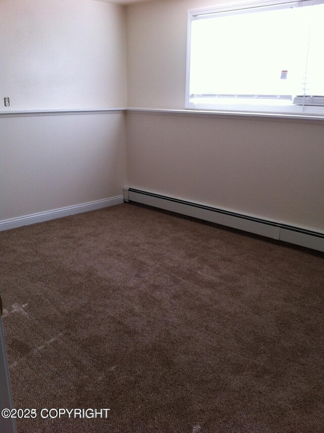 4312 Penguin St, Anchorage, AK 99503 - unfurnished room with carpet, baseboard heating, and baseboards