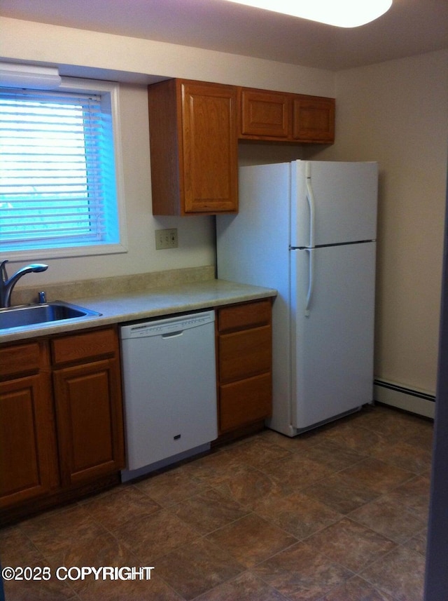 4312 Penguin St, Anchorage, AK 99503 - kitchen with white appliances, a sink, baseboard heating, brown cabinetry, and light countertops
