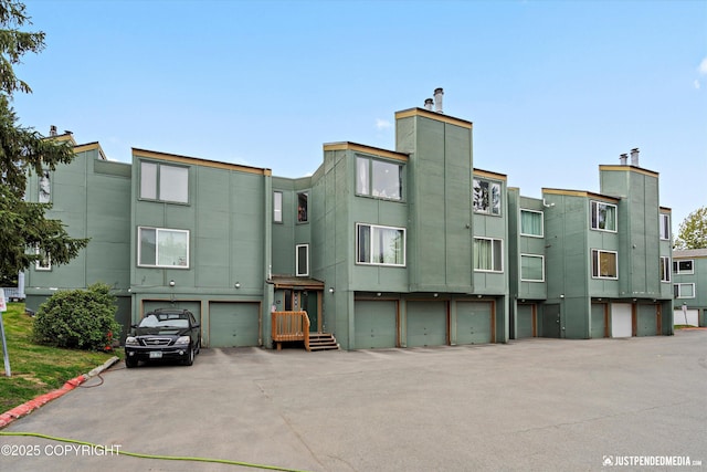 905 Wild Rose Ct # 905, Anchorage, AK 99518 - view of building exterior featuring an attached garage