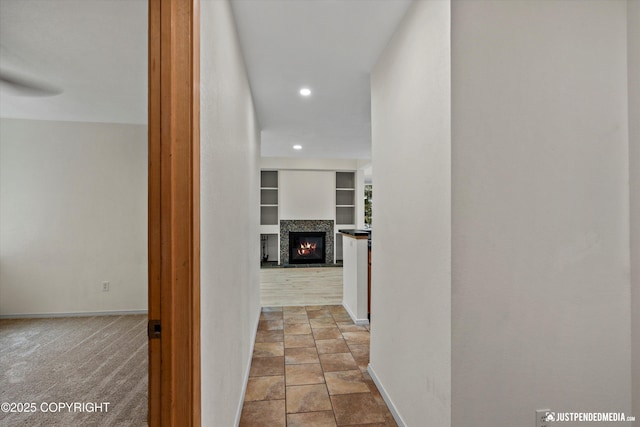 905 Wild Rose Ct # 905, Anchorage, AK 99518 - hall with recessed lighting, baseboards, and built in shelves