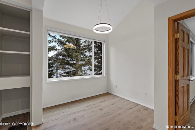 905 Wild Rose Ct # 905, Anchorage, AK 99518 - unfurnished dining area featuring wood finished floors and baseboards