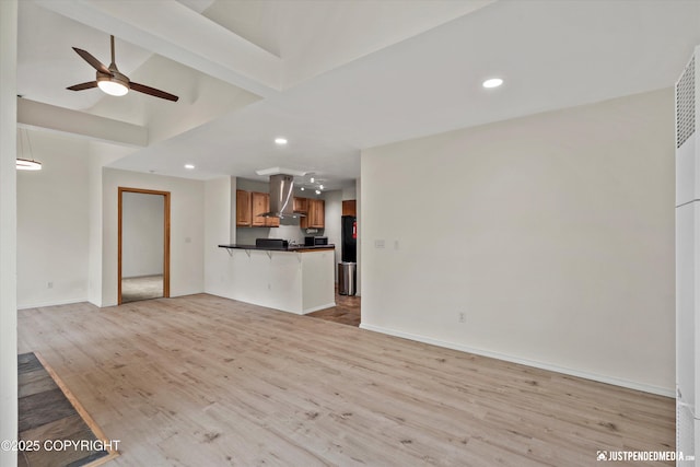 905 Wild Rose Ct # 905, Anchorage, AK 99518 - unfurnished living room featuring light wood-type flooring, ceiling fan, recessed lighting, and baseboards