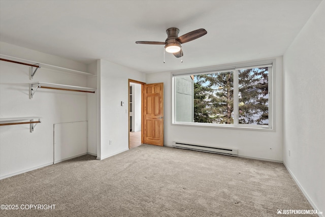 905 Wild Rose Ct # 905, Anchorage, AK 99518 - unfurnished bedroom featuring a baseboard heating unit, carpet flooring, baseboards, and a closet