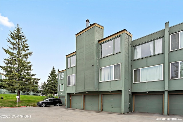905 Wild Rose Ct # 905, Anchorage, AK 99518 - view of building exterior with a garage