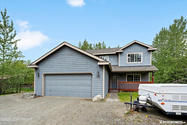 1061 E Mulchatna Dr, Wasilla, AK 99654 - view of front of home featuring a porch, an attached garage, dirt driveway, and a shingled roof