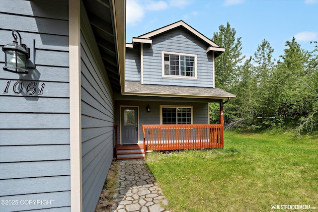 1061 E Mulchatna Dr, Wasilla, AK 99654 - view of front of house featuring a porch and a front lawn