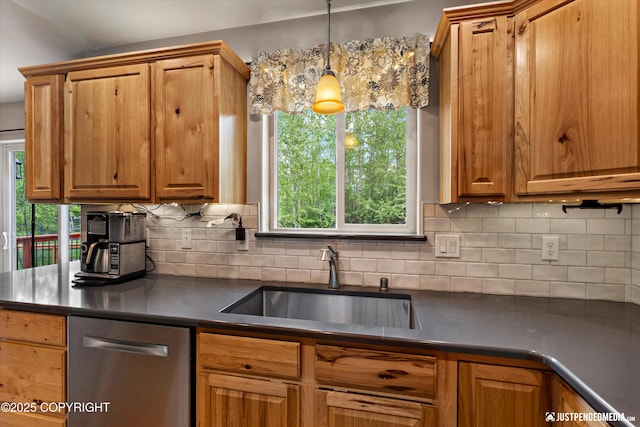 1061 E Mulchatna Dr, Wasilla, AK 99654 - kitchen with a sink, stainless steel dishwasher, dark countertops, backsplash, and brown cabinetry