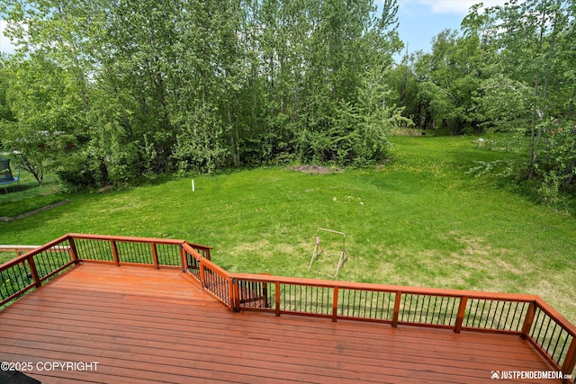 1061 E Mulchatna Dr, Wasilla, AK 99654 - wooden deck with a trampoline and a yard