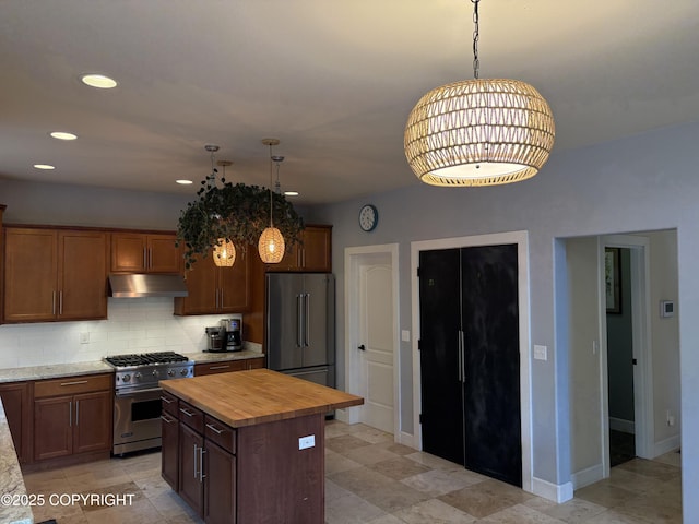13125 W Curry Ridge Cir, Eagle River, AK 99577 - kitchen with premium appliances, under cabinet range hood, butcher block counters, tasteful backsplash, and a kitchen island