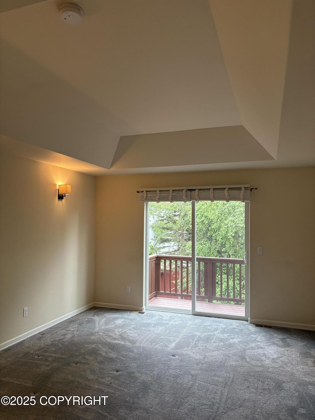 13125 W Curry Ridge Cir, Eagle River, AK 99577 - carpeted spare room with a smoke detector, baseboards, and a raised ceiling