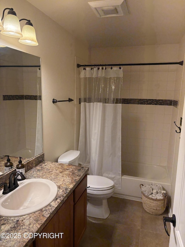 13125 W Curry Ridge Cir, Eagle River, AK 99577 - full bathroom featuring vanity, toilet, shower / bath combo with shower curtain, and tile patterned floors