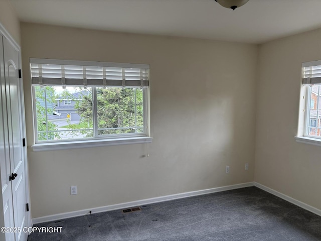13125 W Curry Ridge Cir, Eagle River, AK 99577 - empty room with dark colored carpet and baseboards