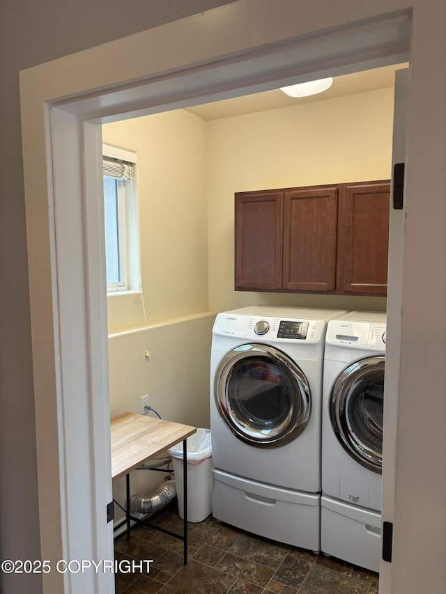 13125 W Curry Ridge Cir, Eagle River, AK 99577 - washroom with cabinet space, washing machine and clothes dryer, and dark stone finish flooring