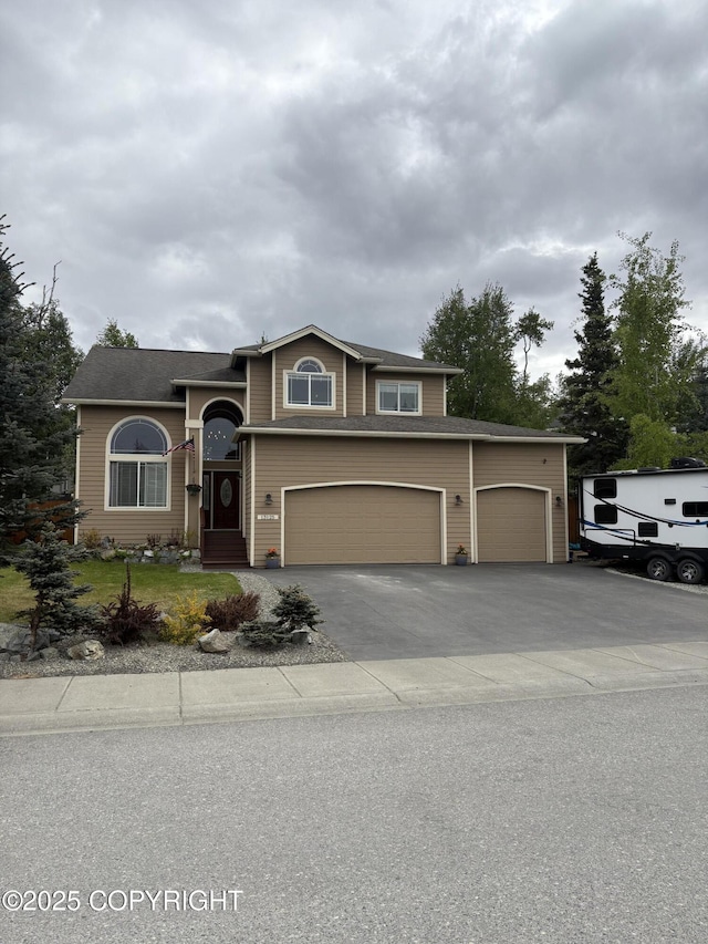 13125 W Curry Ridge Cir, Eagle River, AK 99577 - view of front facade featuring driveway