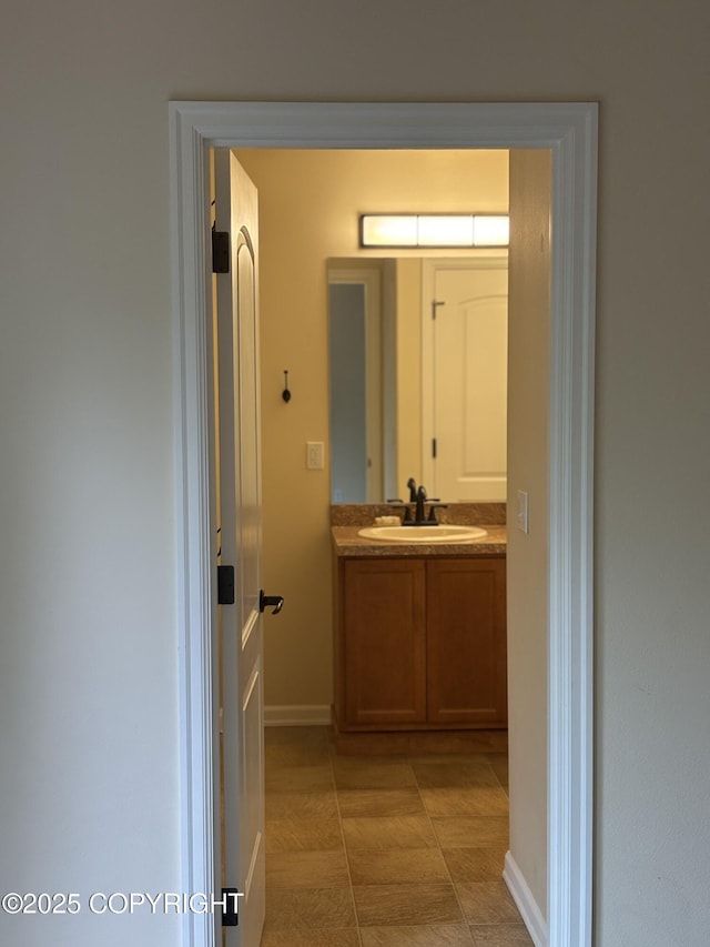 13125 W Curry Ridge Cir, Eagle River, AK 99577 - bathroom featuring vanity and baseboards