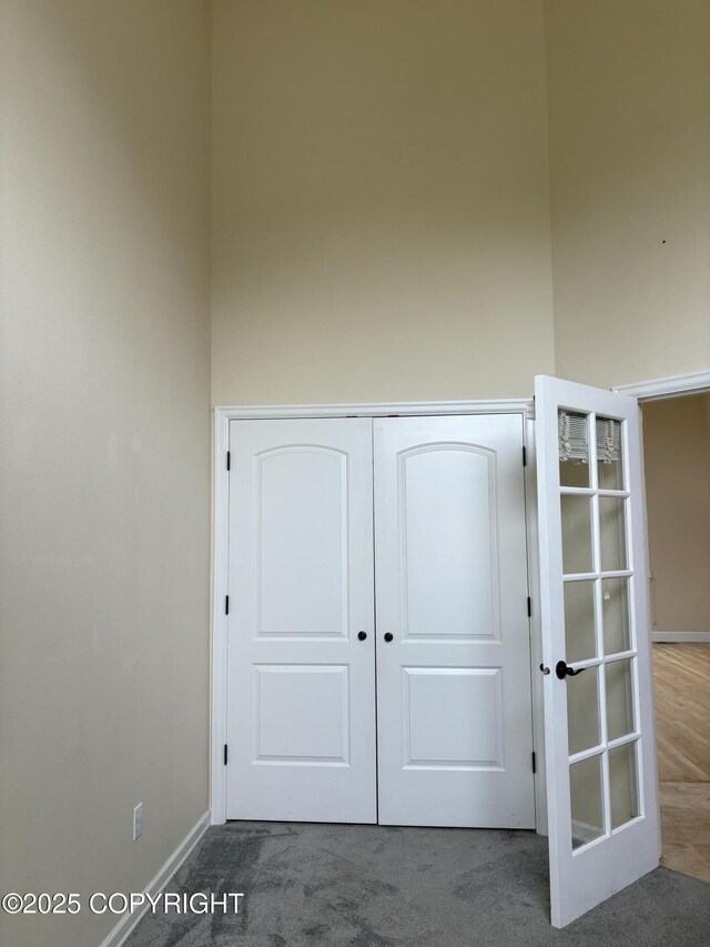 13125 W Curry Ridge Cir, Eagle River, AK 99577 - unfurnished bedroom with carpet floors, baseboards, and a closet
