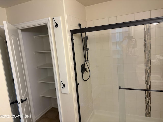 13125 W Curry Ridge Cir, Eagle River, AK 99577 - full bathroom featuring a shower stall and tile patterned flooring