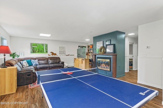 45035 Ptarmigan Pl, Soldotna, AK 99669 - playroom with wood finished floors and a glass covered fireplace