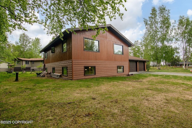 45035 Ptarmigan Pl, Soldotna, AK 99669 - view of side of property featuring a garage