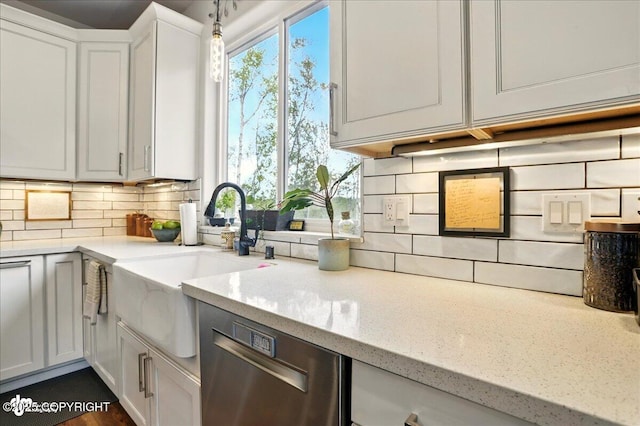 8727 Turlock Dr, Eagle River, AK 99577 - kitchen with a sink, tasteful backsplash, dishwasher, and light stone countertops