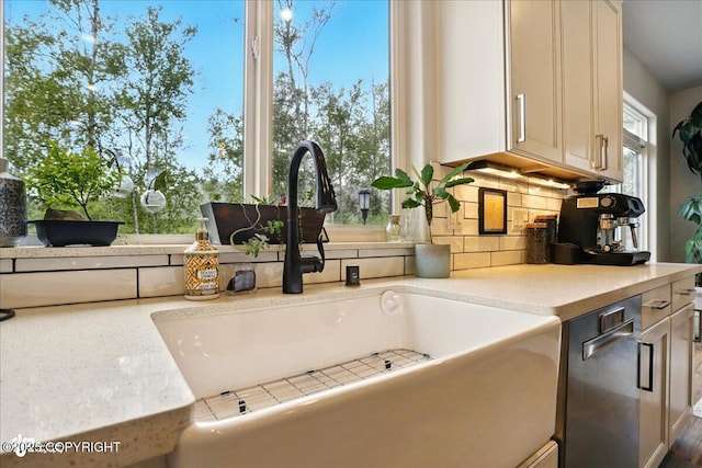 8727 Turlock Dr, Eagle River, AK 99577 - kitchen view of a sink, backsplash, light countertops, and white cabinetry