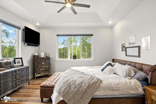 8727 Turlock Dr, Eagle River, AK 99577 - bedroom featuring a raised ceiling, wood finished floors, recessed lighting, and a ceiling fan